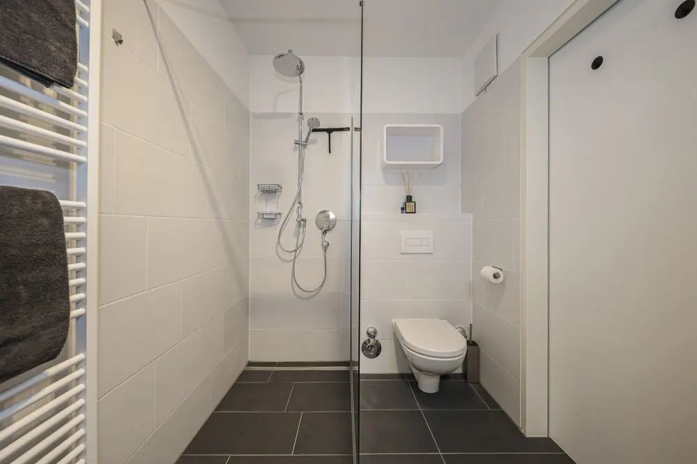 KITZIMMO-exklusive Neubauwohnung mit Hahnenkammblick - Immobilien Kitzbühel.-11